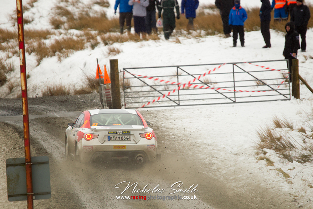 A Toyota GT86 R3 rally car in the snow of the Pikes Peak stage of the 2016 Mid Wales Stages Rally.